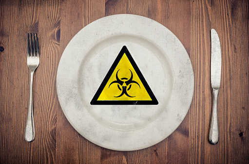 concept: genfood - bio warning sign on a plate