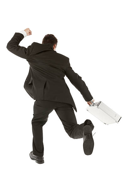 istock Businessman running with a briefcase 180821379