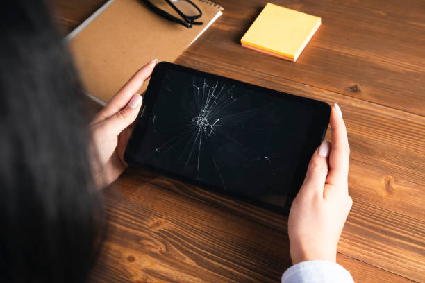 istock woman holding a broken tablet on her hand 1808215818