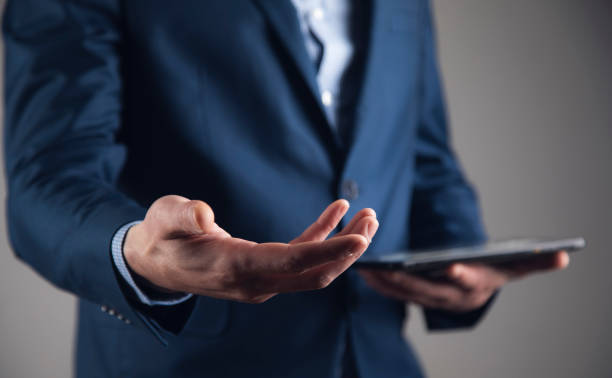 istock man hand holding smart phone 1808215834