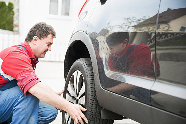 istock Mount the wheel on a car 180821838