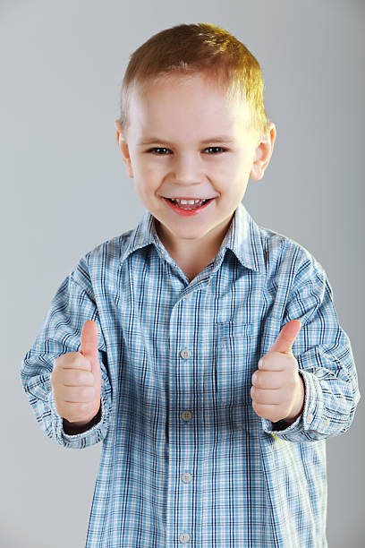 istock Happy boy giving thumbs up 180821985