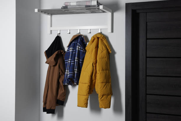 istock Stylish coat rack on white wall in hallway. Interior design 1808220352