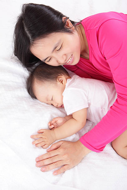 istock Young mother look her sleeping baby 180822042