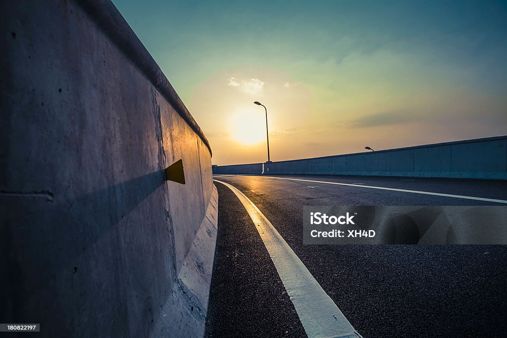 Highway Highway in new overpass with sunset Motor Racing Track Stock Photo