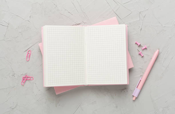 istock Open notebook with stationery on concrete background, top view 1808224630
