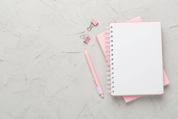 istock Notebooks with stationery on concrete background, top view 1808224633