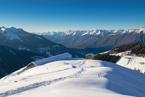 Panoramic view on winter ski resort of Les Gets in winter with view on the French alps and the Mont Blanc