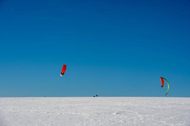 istock Kitesurfing in the snow with a blue sky 1808227358