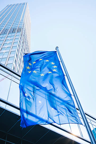 Flag of the European Community - Eurotower Flag of the European Community in front of the Eurotower in Frankfurt am Main european union symbol stock pictures, royalty-free photos & images