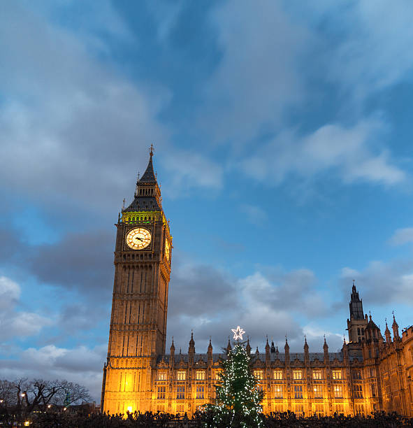 istock Big Ben in London with Christmas tree at dusk 180822962