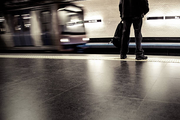istock Solitary man waiting for subway train 180823233