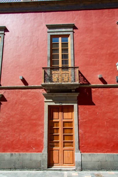 istock Old door with a window and balcony on a house 1808235068