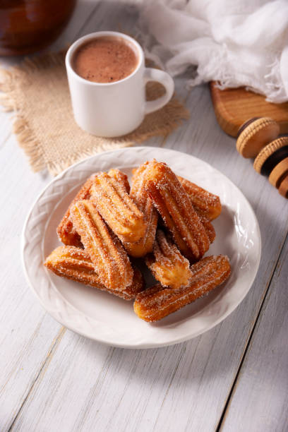istock Churros with sugar and hot chocolate 1808237505
