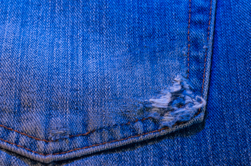 detail of a ripped jeans