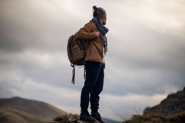istock climber and camper alone in nature 1808242371