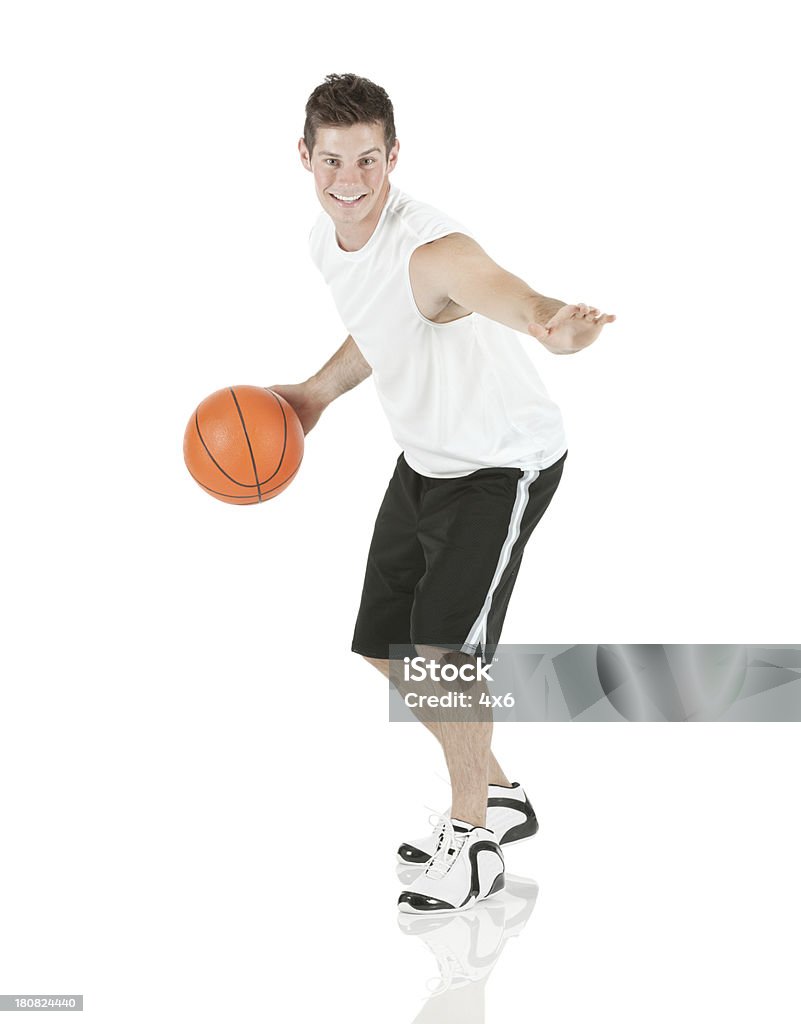 Sportsman playing with a basketball 20-29 Years Stock Photo