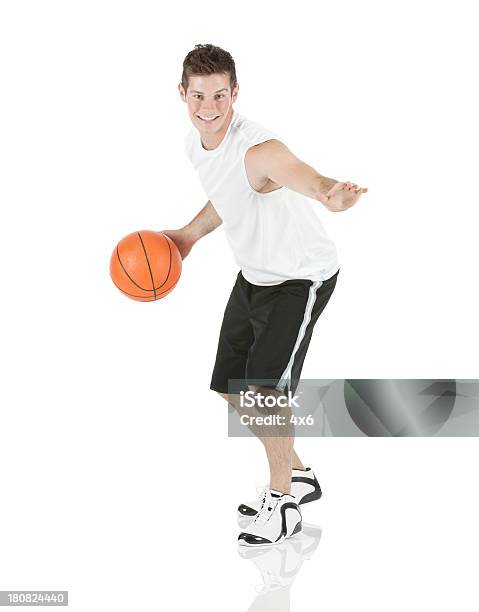 Sportsman Playing With A Basketball Stock Photo - Download Image Now - 20-29 Years, Activity, Adult
