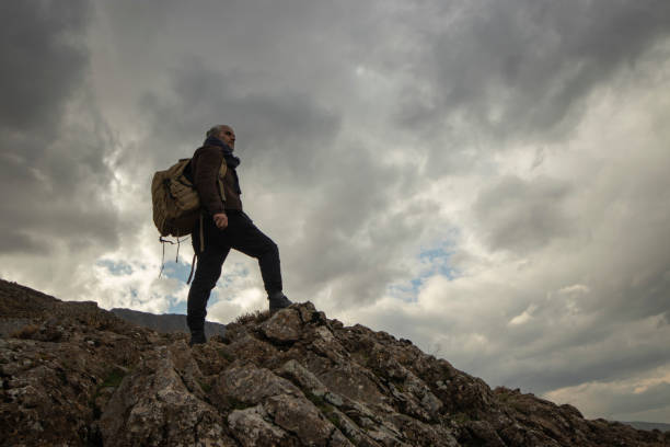 istock climber and camper alone in nature 1808244510