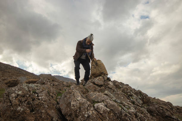 istock climber and camper alone in nature 1808245557