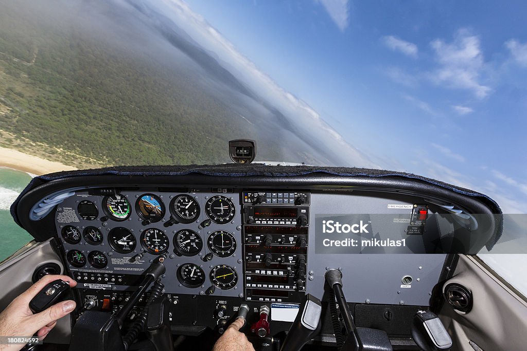 Cockpit Cockpit view, flying and banking to the left. Aircraft Canopy Stock Photo