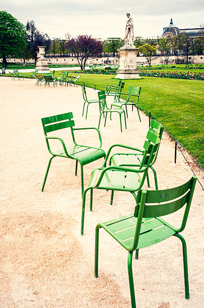 istock Tuileries Garden in Paris with green chairs 180824809