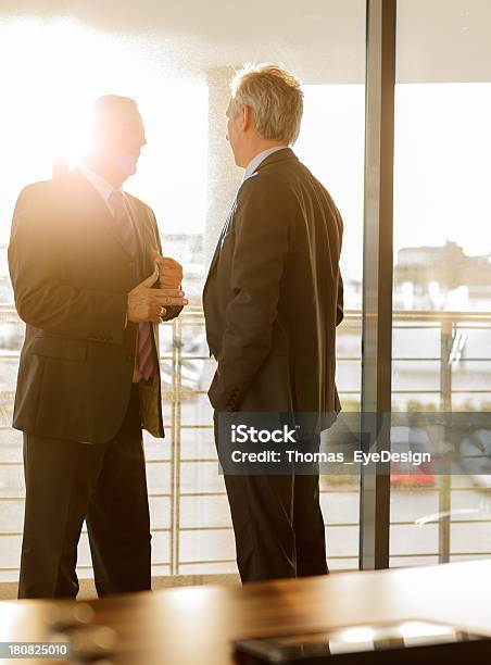 Two Businessmen Talking In A Business Meeting Stock Photo - Download Image Now - Manager, 45-49 Years, 50-54 Years