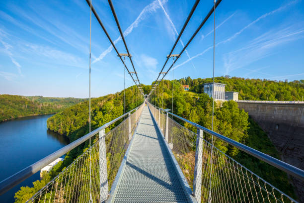 Pedestrian suspension bridge above Rappbodetalsperre lake and Rappbode River in Harz Mountains National Park, Germany