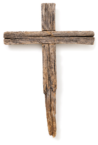 A wooden cross set on a white background.