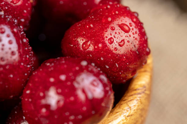 istock covered with drops of water ripe red cherries on the table 1808267140