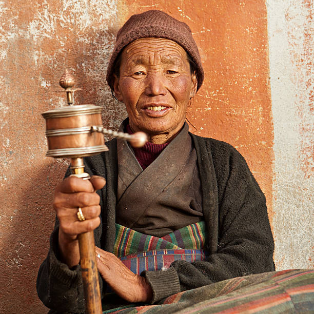 Tibetan woman praying, Mustang