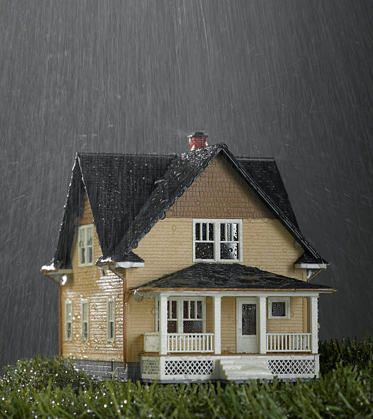 Pouring Rain on House Another house shot in my series of miniature houses. This house is in a major rainstorm. Microburst stock pictures, royalty-free photos & images