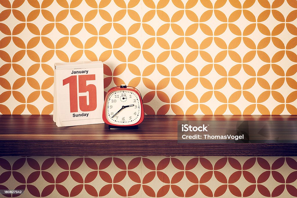 Retro style alarm clock and calendar on shelf Calendar Stock Photo