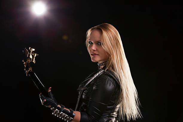 istock Young Woman Playing Guitar 180827864
