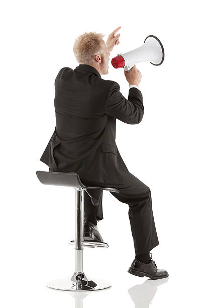 istock Businessman shouting into a bullhorn 180827907