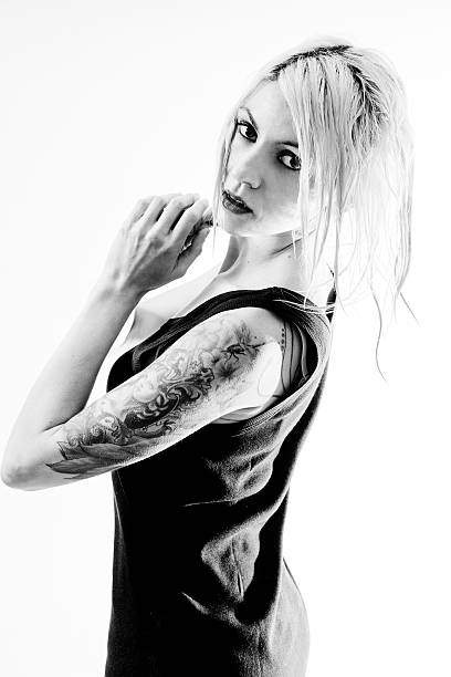 istock Sexy tattooed woman on white 180827977