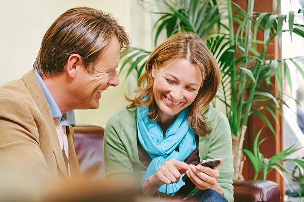 istock Mature couple exchanging telephone numbers 180828147