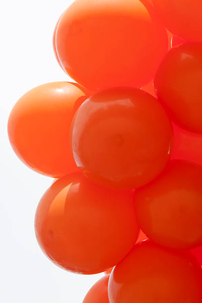 istock bunch of orange balloons 180828408