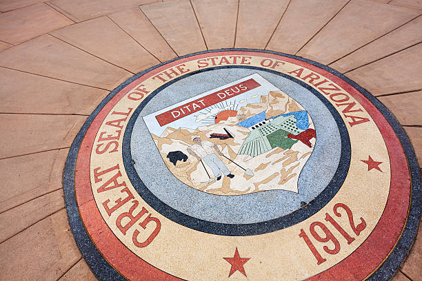 Great Seal of Arizona "The Great Seal of the state of Arizona in stone, outside the Arizona State Capitol in Phoenix." phoenix stone stock pictures, royalty-free photos & images