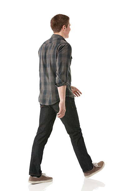 istock Rear view of a young man walking 180828845