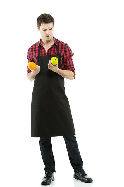 istock Man holding an orange and apple 180828913