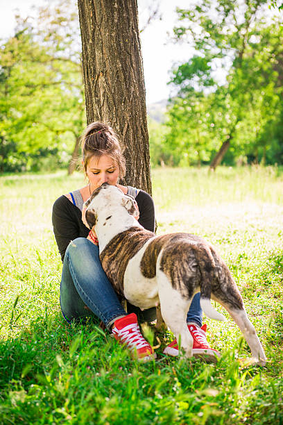 istock Young woman with two dogs 180829084