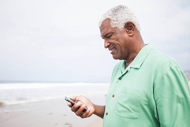 istock African American Man Checking Smartphone 180829168