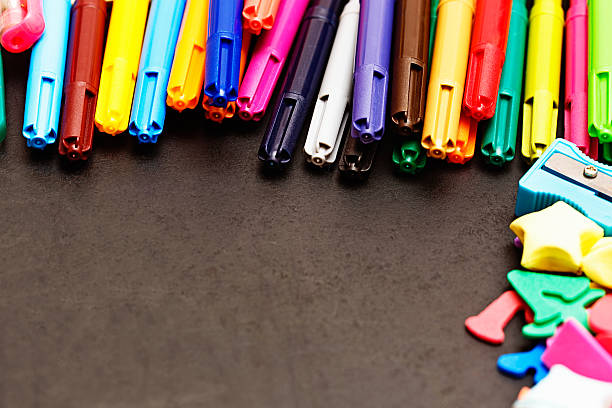 istock Rainbow felt-tip pens and letters on black with copy space 180829287