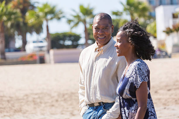 istock Couple on holidays at the beach 180830115