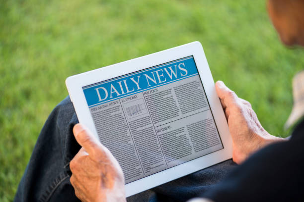 istock Senior man reading news on tablet pc 180830726