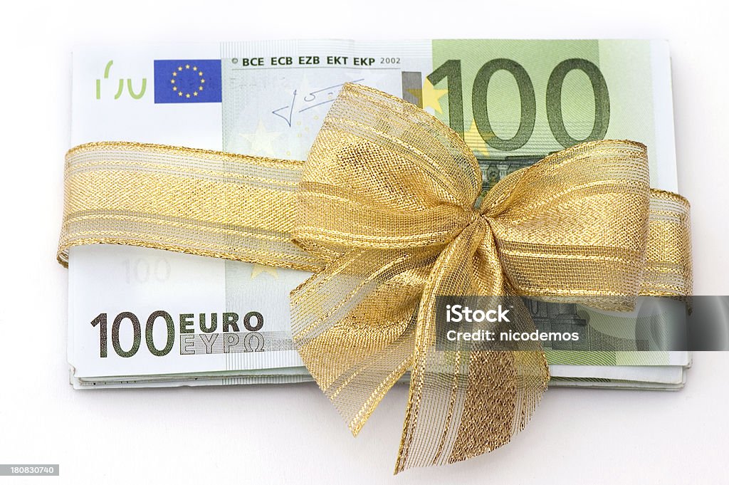 Euro Money Gift Pile of 100 Euro Banknotes wrapped as a Gift.White Background. Currency Stock Photo