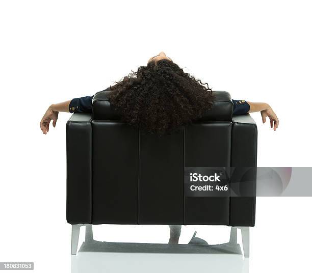 Businesswoman In An Armchair Stock Photo - Download Image Now - 20-29 Years, Adult, Adults Only