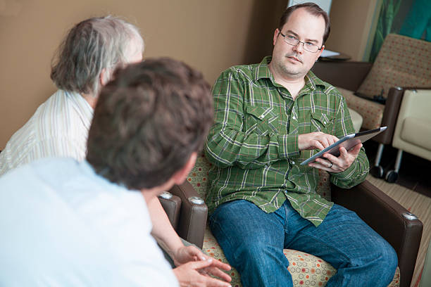 istock Team member taking notes on digital tablet at a meeting 180831152