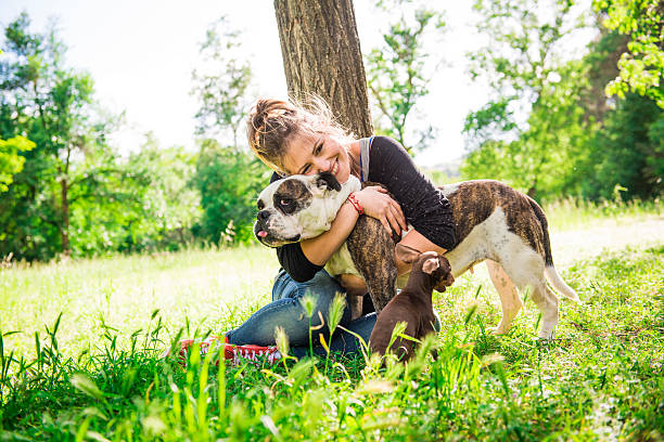 istock Young woman with two dogs 180831197